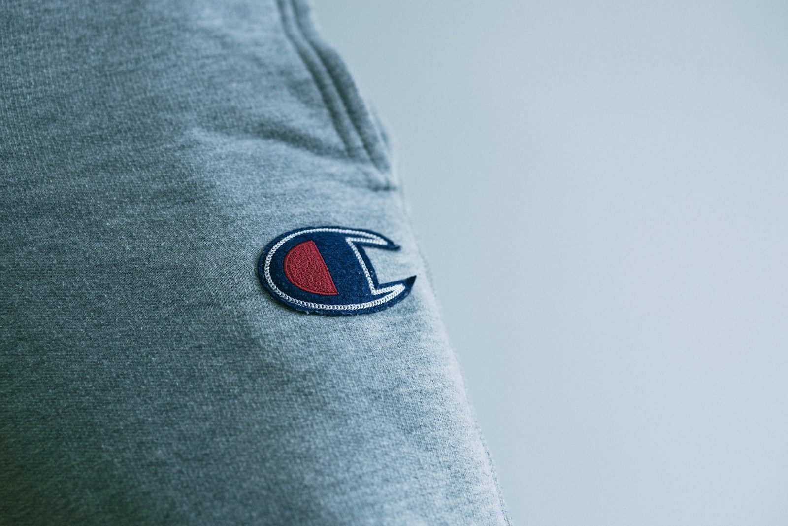 blue denim textile with red and black logo